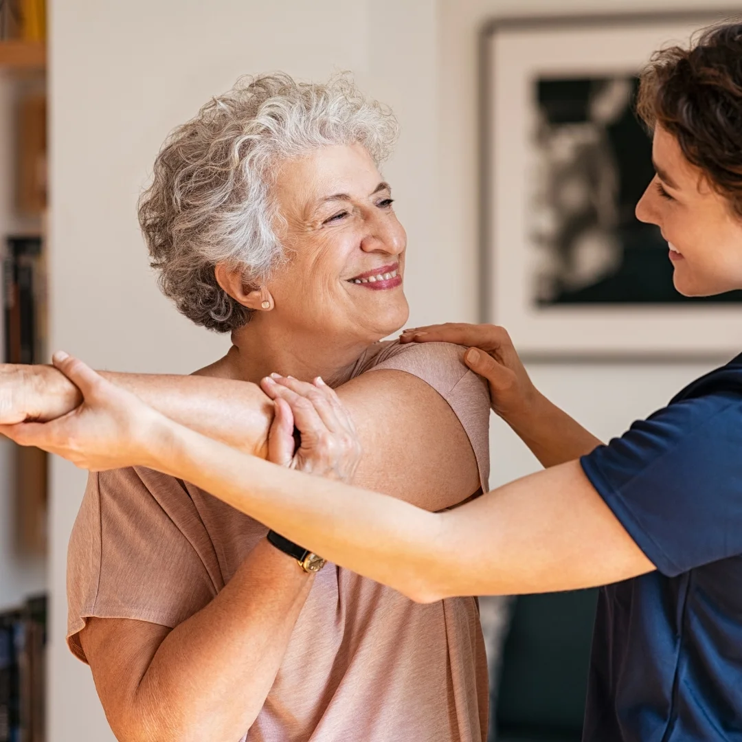 older woman with physiotherapist